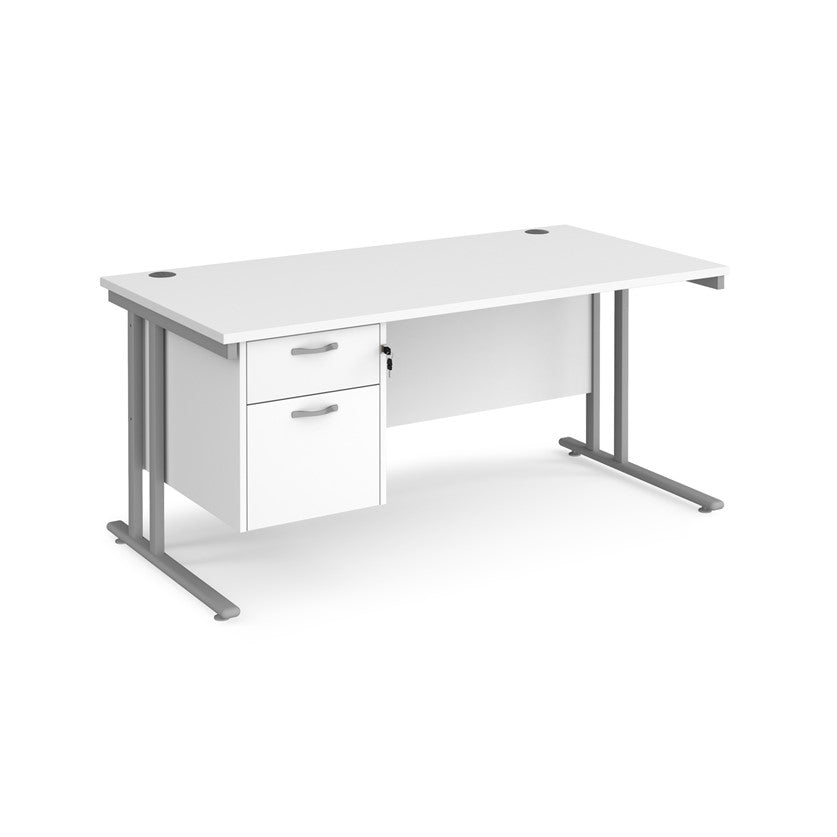 Rectangular office desk with a cantilever frame and a White two-drawer fixed pedestal. The desk has a melamine finish and is pictured against a white background.
