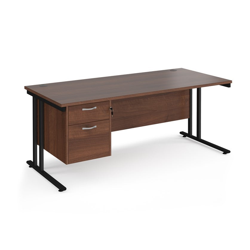 Rectangular office desk with a cantilever frame and a beige two-drawer fixed pedestal. The desk has a melamine finish and is pictured against a white background.
