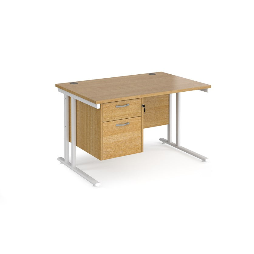 Rectangular office desk with a cantilever frame and a beige two-drawer fixed pedestal. The desk has a melamine finish and is pictured against a white background.
