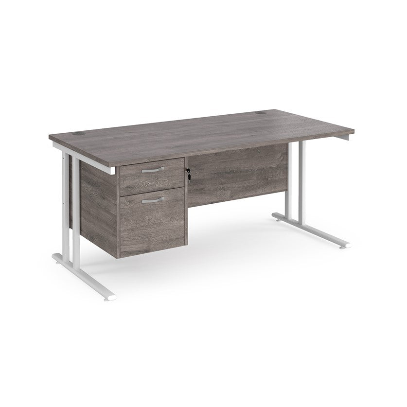 Rectangular office desk with a cantilever frame and a Grey two-drawer fixed pedestal. The desk has a melamine finish and is pictured against a white background.
