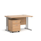A Oak finish desk with a 2 drawer pedestal bundle on a white background