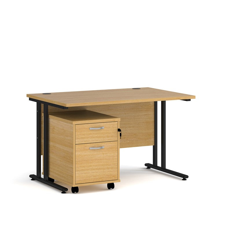 A Oak finish desk with a 2 drawer pedestal bundle on a white background