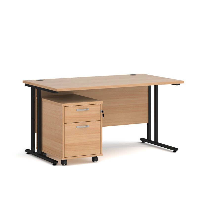 A oak finish desk with a 2 drawer pedestal bundle on a white background