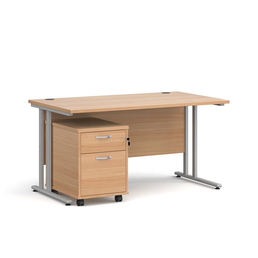 A oak finish desk with a 2 drawer pedestal bundle on a white background