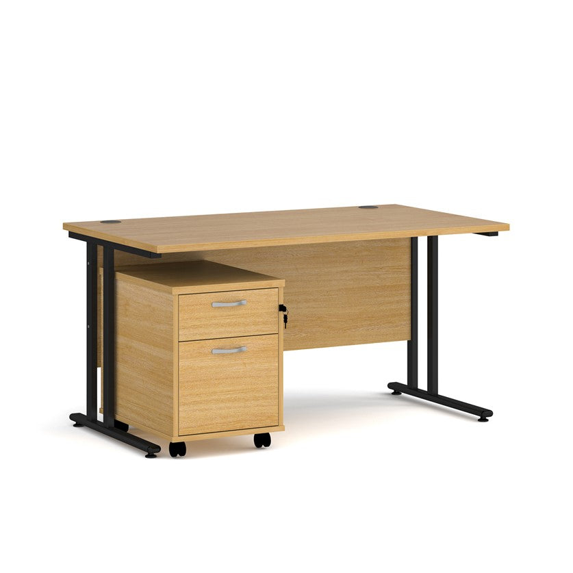 A oak finish desk with a 2 drawer pedestal bundle on a white background