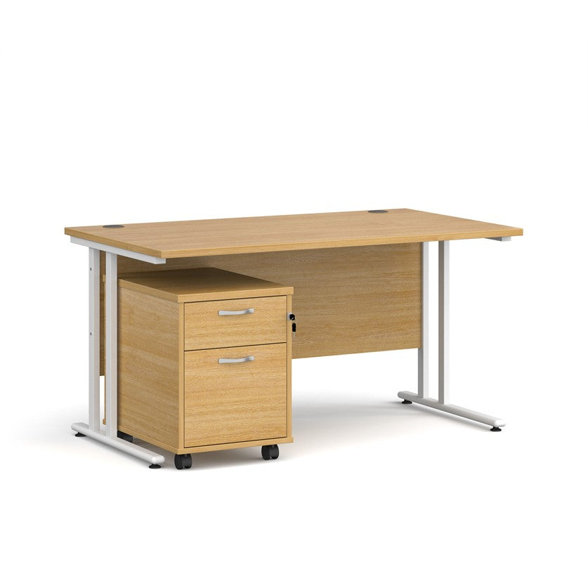 A oak finish desk with a 2 drawer pedestal bundle on a white background

