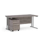 A Grey finish desk with a 2 drawer pedestal bundle on a white background
