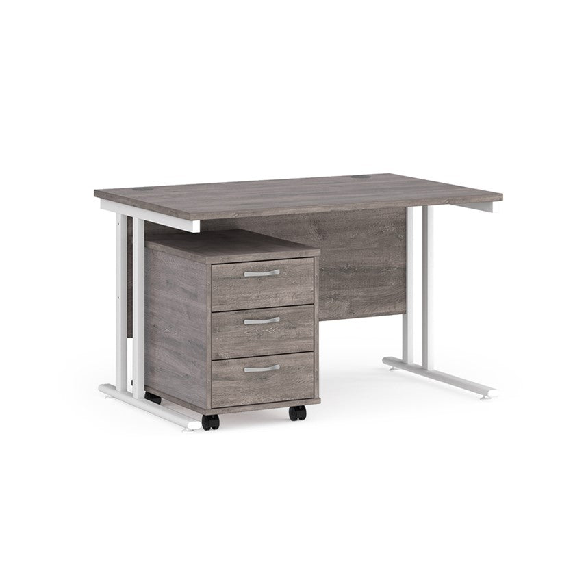 A Grey Oak finish desk with a 3 drawer pedestal bundle on a white background