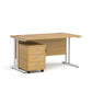 A Oak  finish desk with a 3 drawer pedestal bundle on a white background