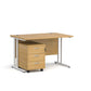 A Oak finish desk with a 3 drawer pedestal bundle on a white background
