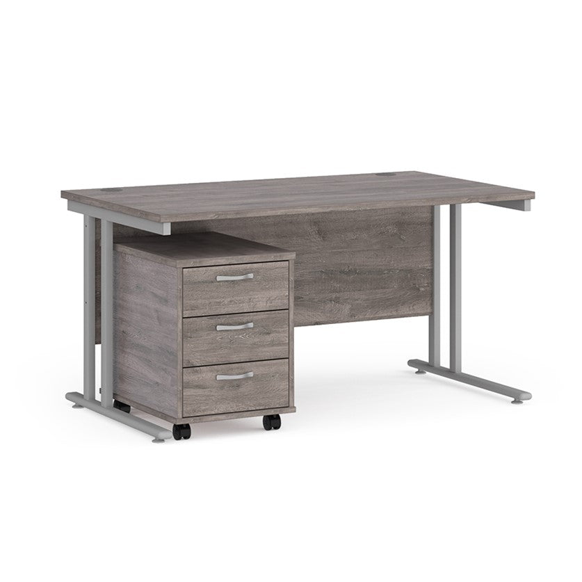 A Grey finish desk with a 3 drawer pedestal bundle on a white background