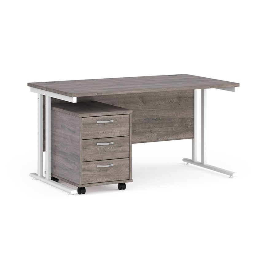 A Grey finish desk with a 3 drawer pedestal bundle on a white background