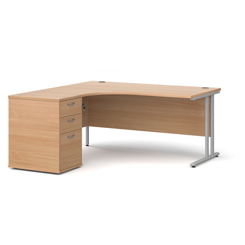 A left-hand corner desk with a cantilever frame and a beige melamine desktop, featuring a pedestal with two drawers.
