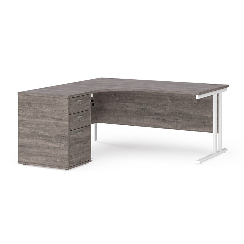 A left-hand corner desk with a cantilever frame and a Grey melamine desktop, featuring a pedestal with two drawers.