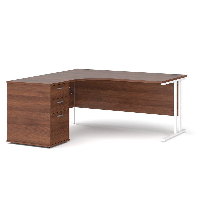 A left-hand corner desk with a cantilever frame and a Walnut melamine desktop, featuring a pedestal with two drawers.

