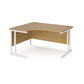 A left hand ergonomic desk with a cantilever frame made of metal and a wooden desktop, positioned against a white background.