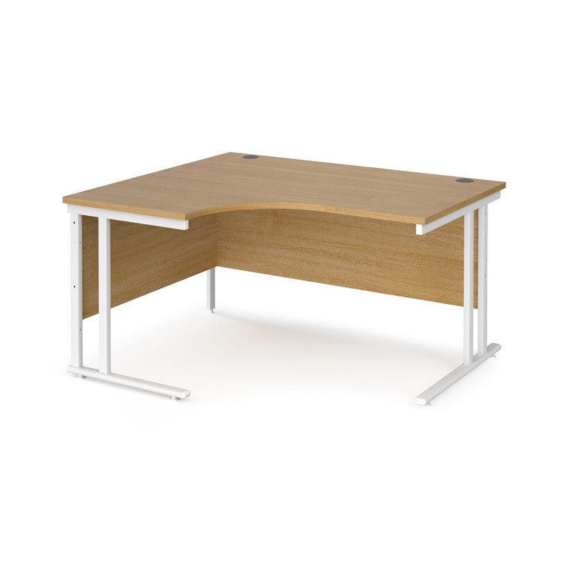 A left hand ergonomic desk with a cantilever frame made of metal and a wooden desktop, positioned against a white background.
