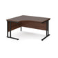 A left hand ergonomic desk with a cantilever frame made of metal and a wooden desktop, positioned against a white background.