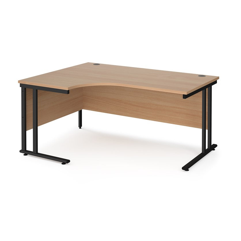 A left hand desk in beech finish with black metal legs. 