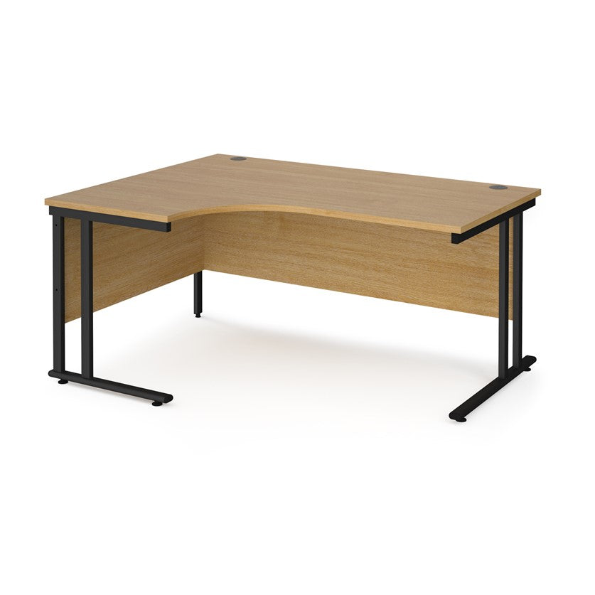 A left hand desk in beech finish with black metal legs. 