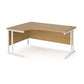 A left hand desk in oak finish with white metal legs.