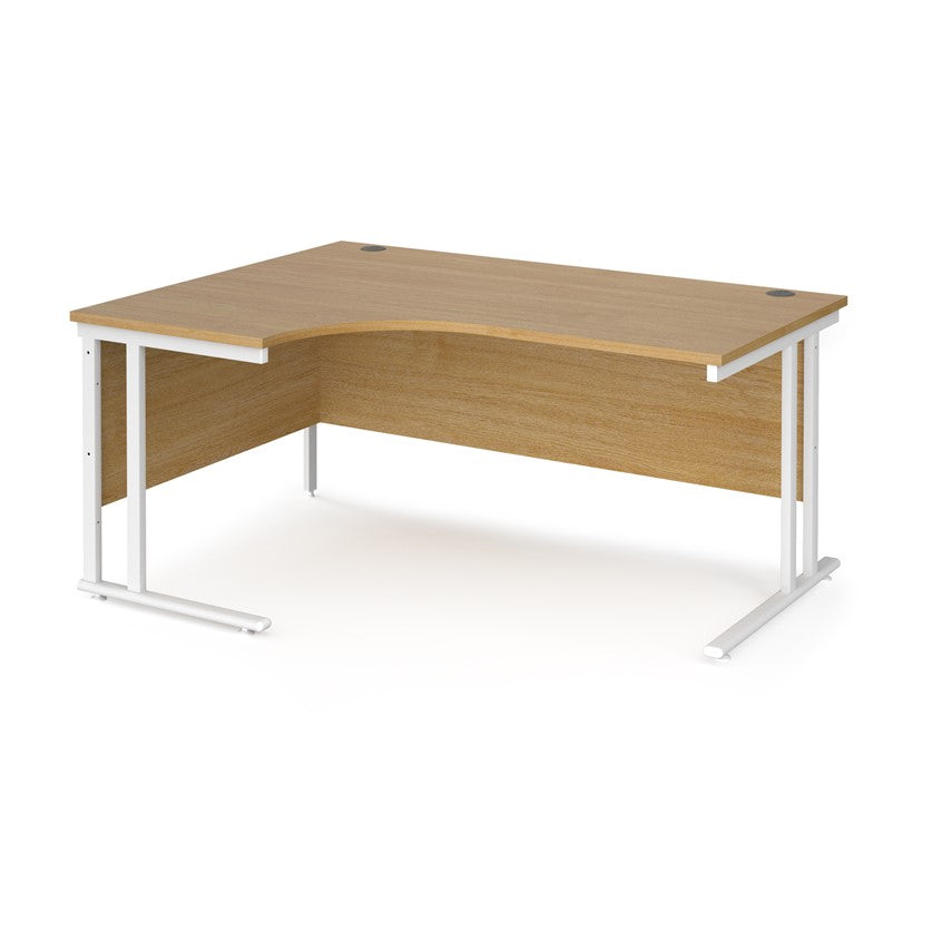 A left hand desk in oak finish with white metal legs.