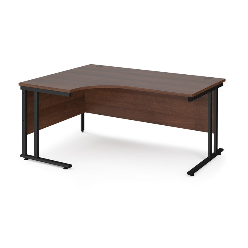 A left hand desk in walnut finish with black metal legs. 