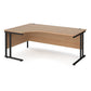 A left hand desk in beech finish with black metal legs.