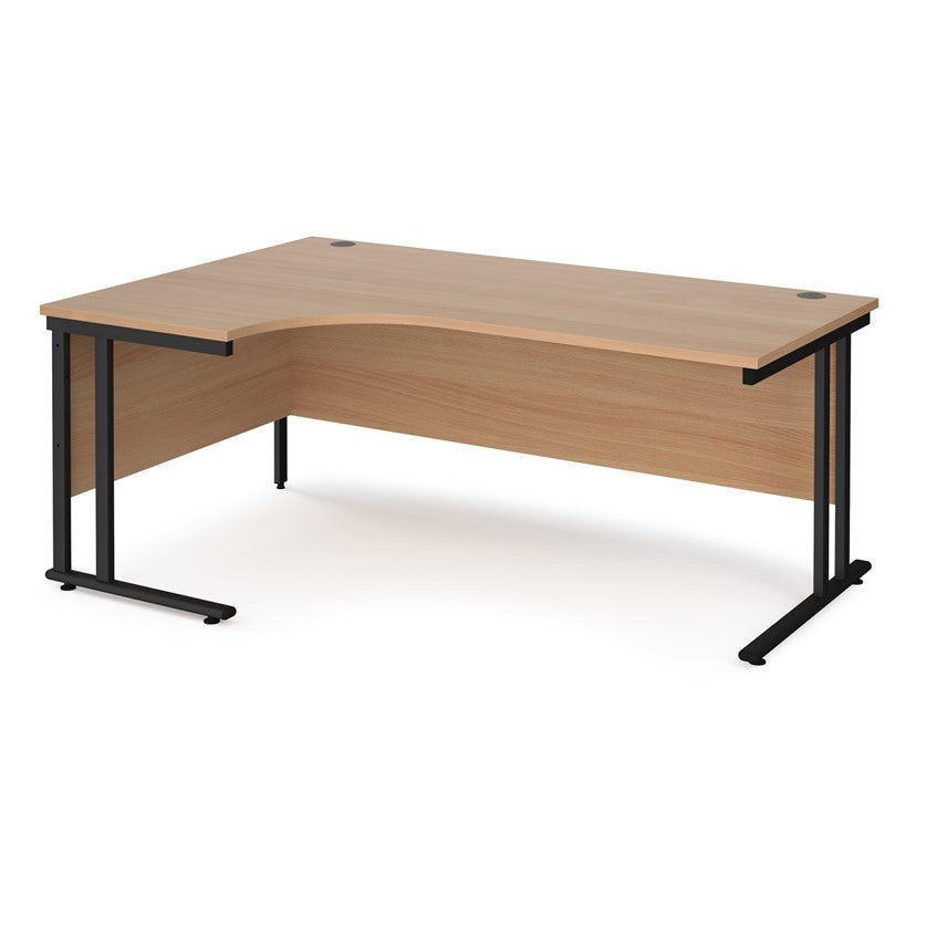 A left hand desk in beech finish with black metal legs.