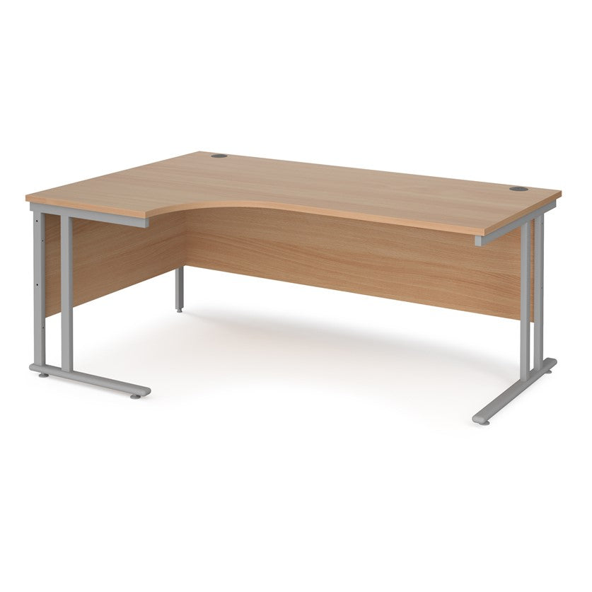 A left hand desk in beech finish with grey metal legs.