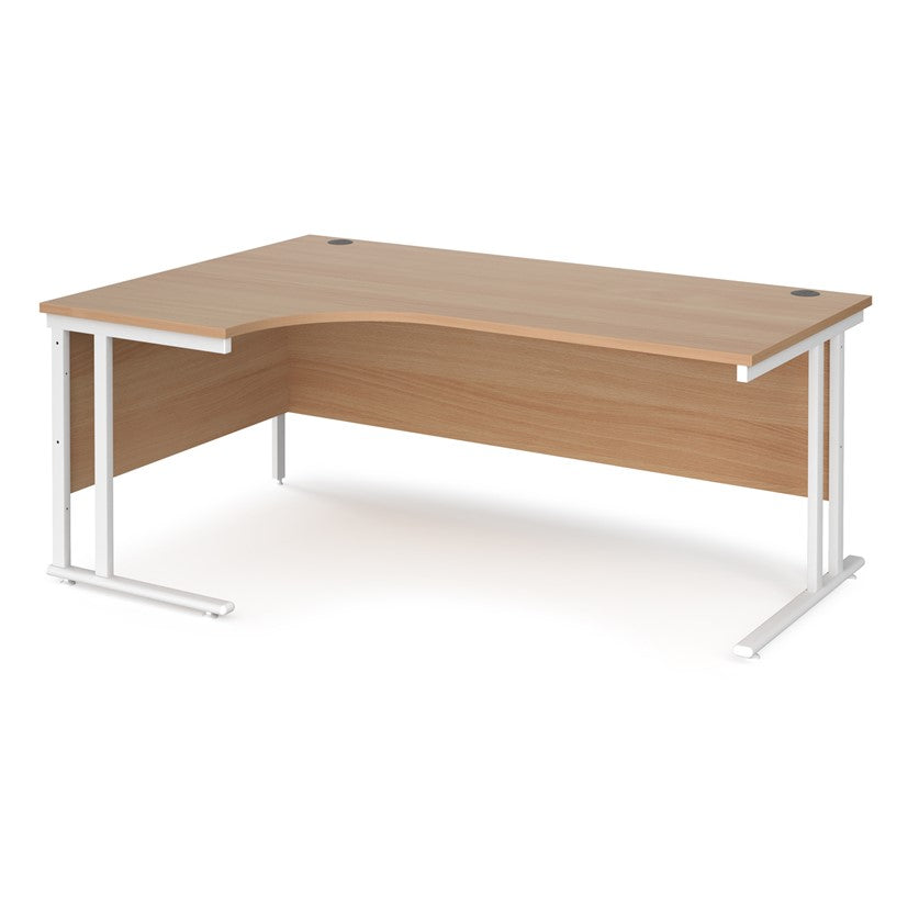 A left hand desk in beech finish with white metal legs. 