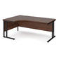 A left hand desk in walnut finish with black metal legs. 
