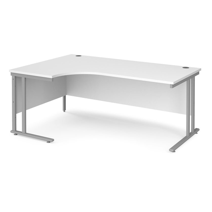 A left hand desk in white with grey metal legs.