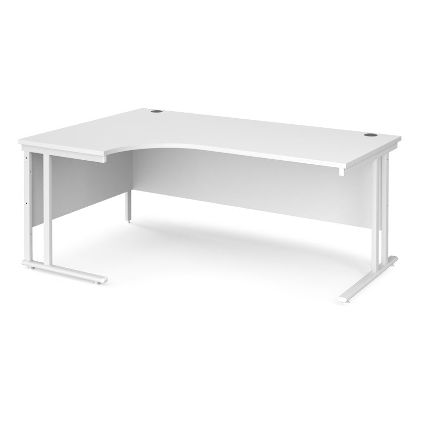 A left hand desk in white with white metal legs. 