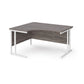 A left hand ergonomic desk with a cantilever frame made of metal and a wooden desktop, positioned against a white background.