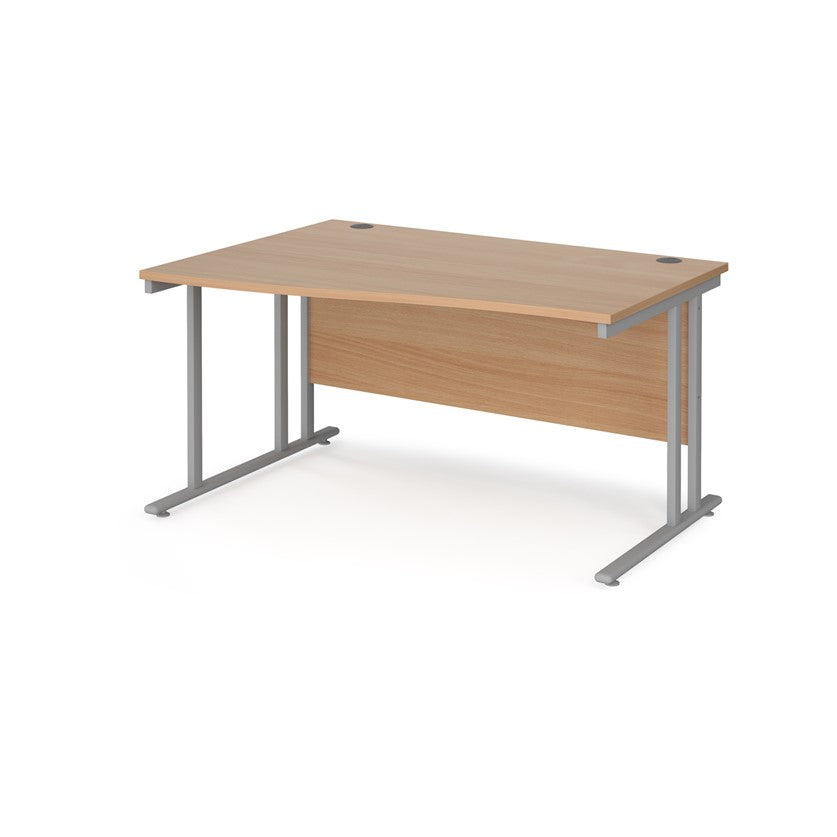 A rectangular office desk with a beige melamine tabletop and cantilever metal legs.