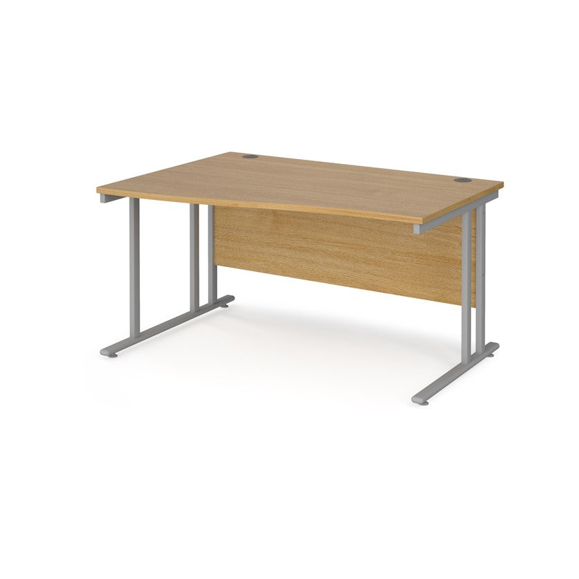 A rectangular office desk with a beige melamine tabletop and cantilever metal legs.