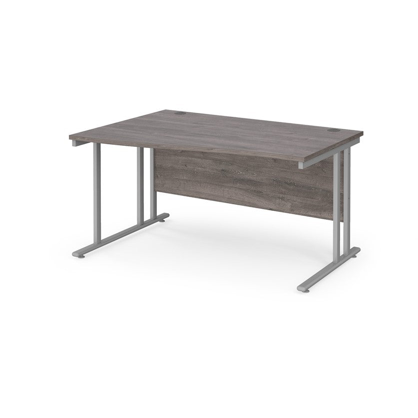 A rectangular office desk with a grey melamine tabletop and cantilever metal legs.