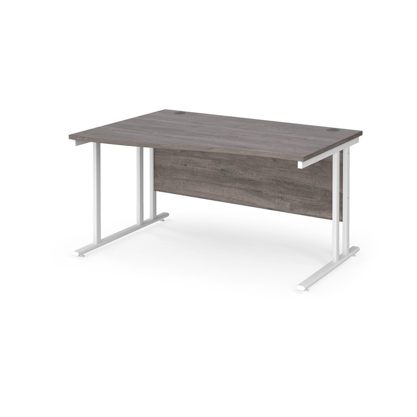A rectangular office desk with a grey melamine tabletop and cantilever metal legs.