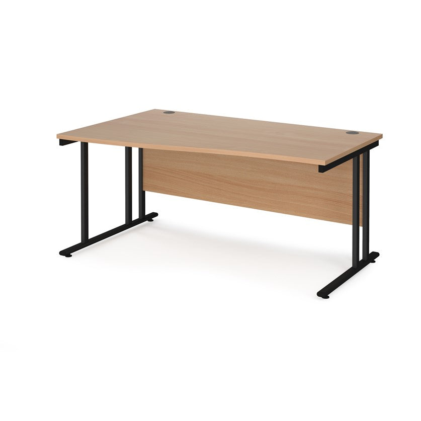 A rectangular office desk with a beige melamine tabletop and black cantilever metal legs.
