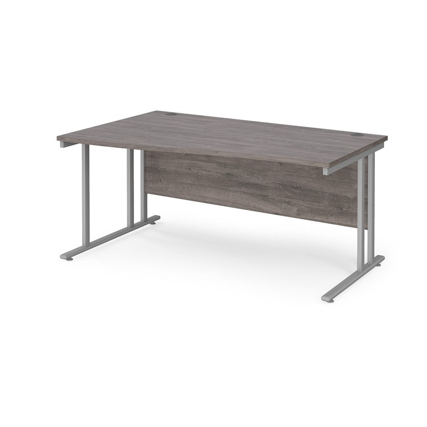 A rectangular office desk with a grey melamine tabletop and grey cantilever metal legs.
