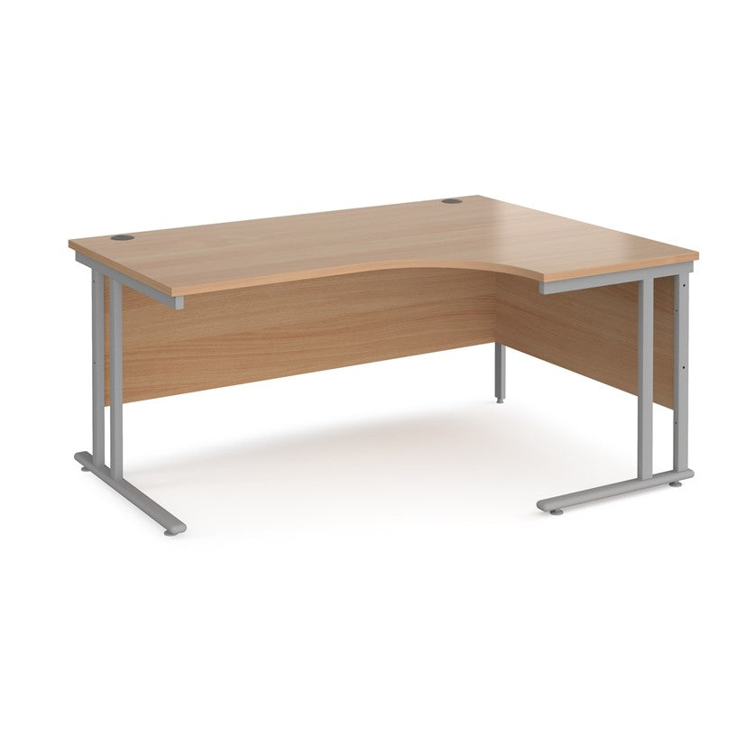 A right-hand ergonomic desk with a beech melamine tabletop and grey-cantilever metal frame.