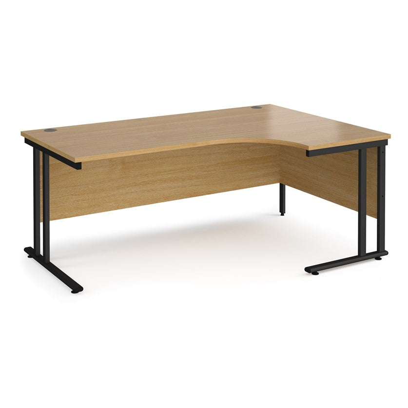 A right-hand ergonomic desk with a beech melamine tabletop and black cantilever metal frame.