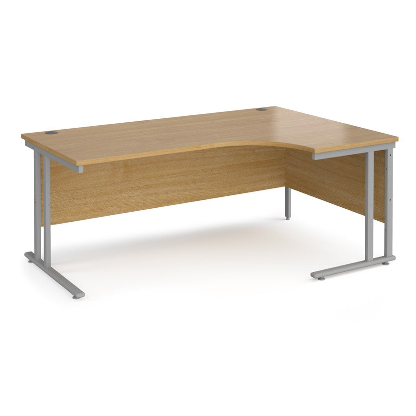 A right-hand ergonomic desk with a beech melamine tabletop and grey cantilever metal frame.
