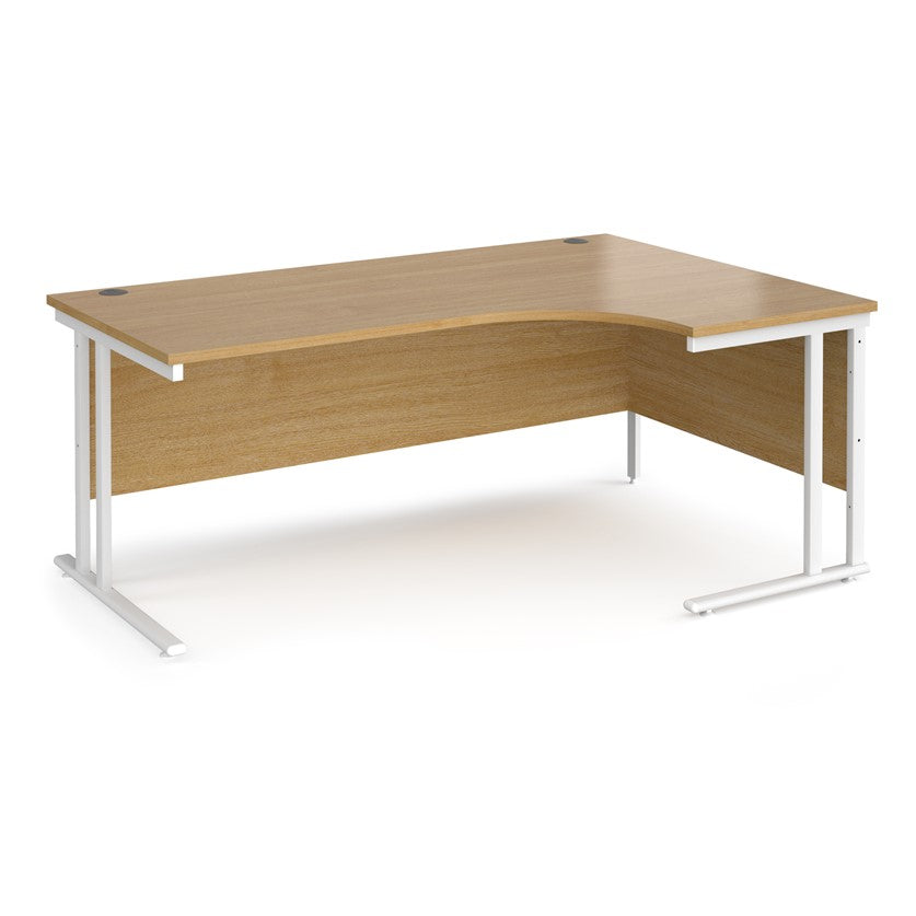 A right-hand ergonomic desk with a beech melamine tabletop and white cantilever metal frame.