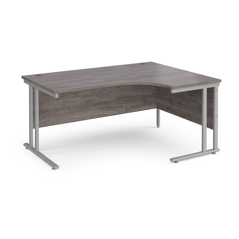 A right-hand ergonomic desk with a grey melamine tabletop and grey cantilever metal frame.
