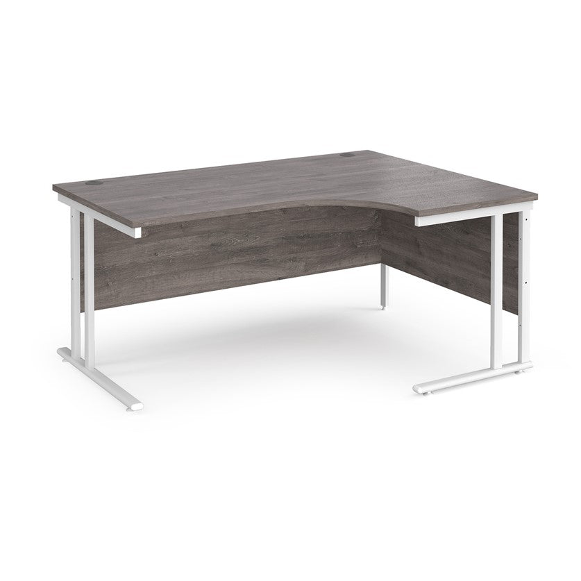 A right-hand ergonomic desk with a grey melamine tabletop and white cantilever metal frame.