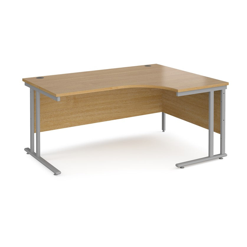 A right-hand ergonomic desk with a beech melamine tabletop and grey cantilever metal frame.