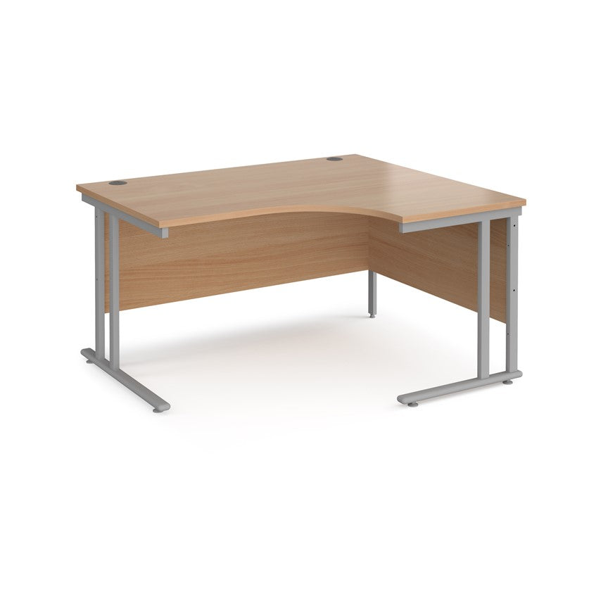 A right-hand ergonomic desk with a brown melamine tabletop and cantilever metal frame.