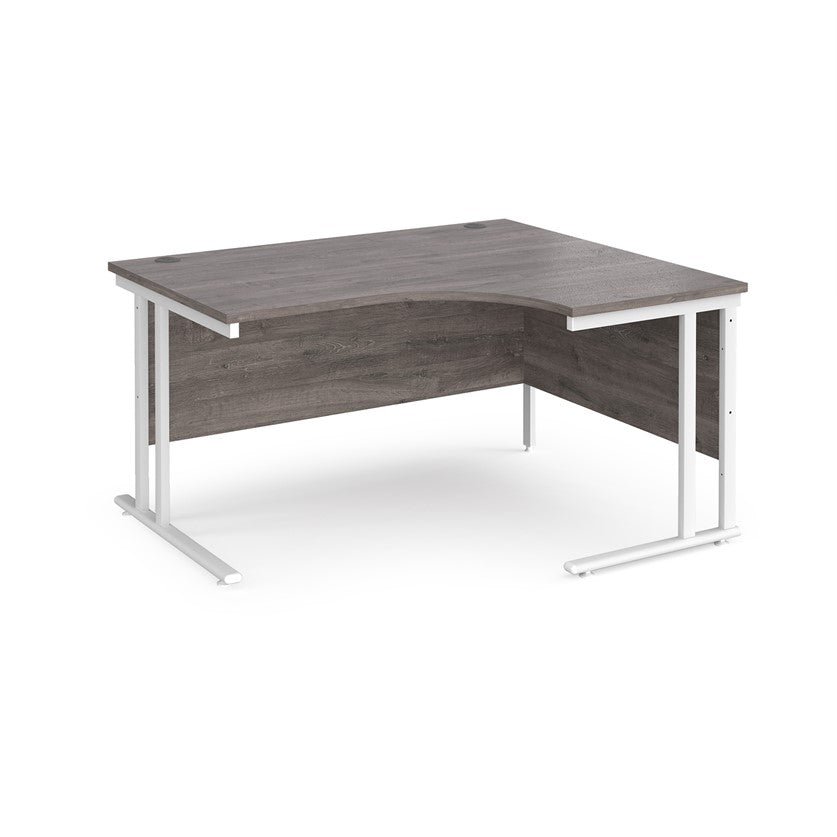 A right-hand ergonomic desk with a grey melamine tabletop and cantilever metal frame.
